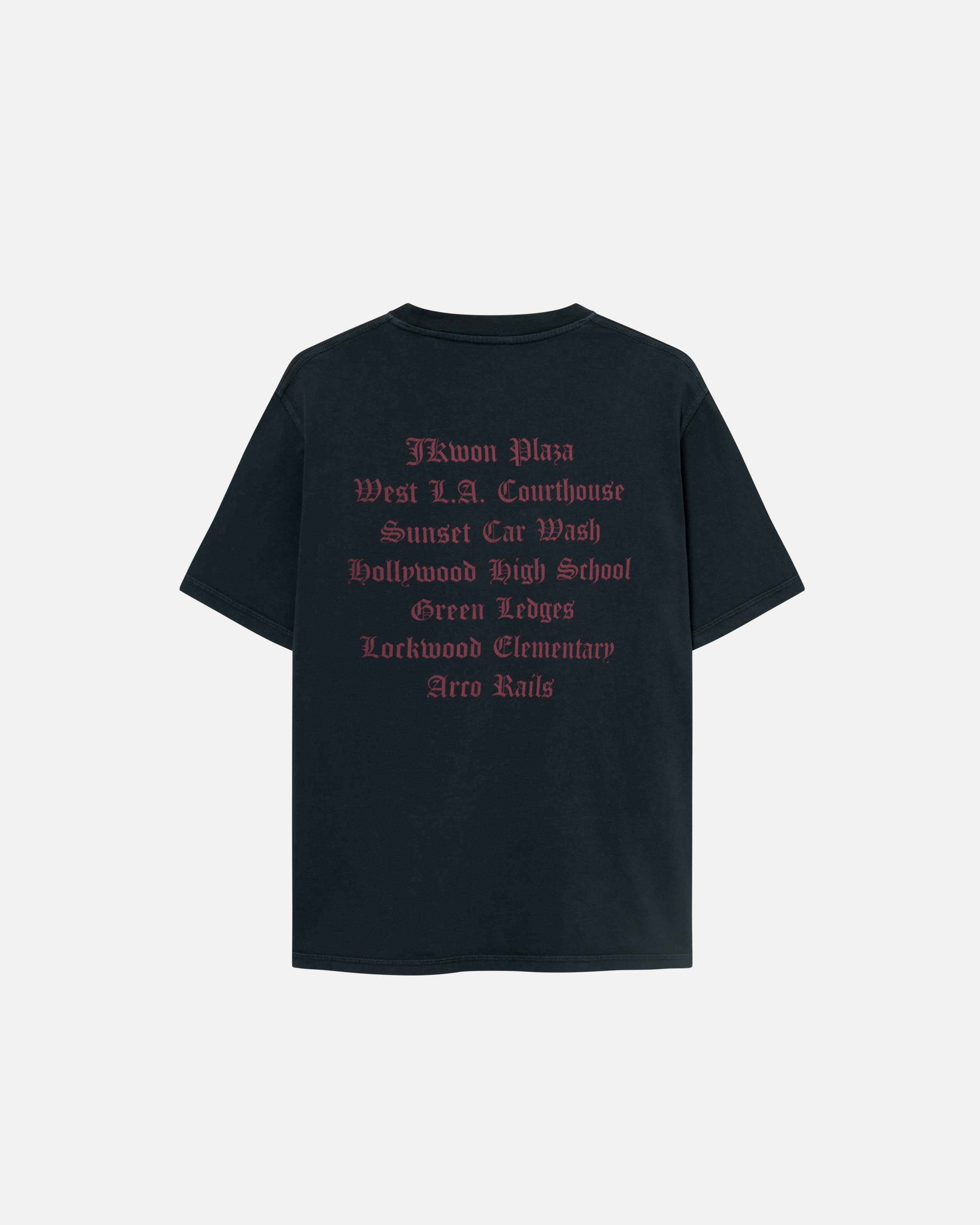 A black garment dyed t-shirt with a large text print on its back