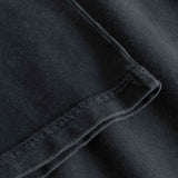 Close up of sleeve and tonal stitchings on a black t-shirt