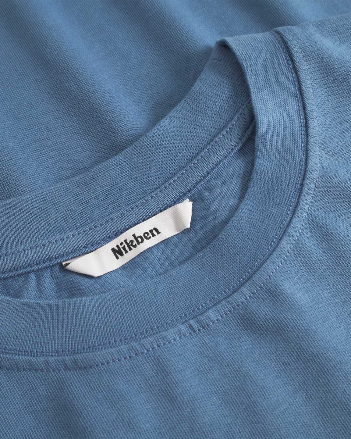 Close up of collar on a blue t-shirt