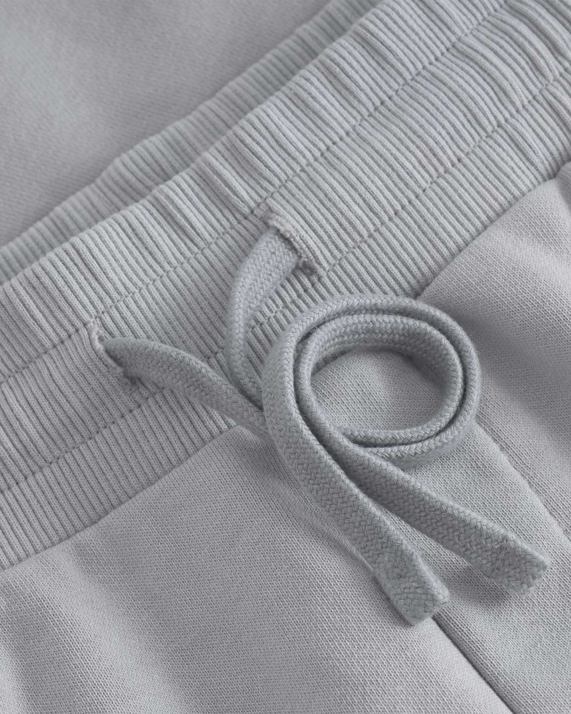 Close up of drawstrings on grey sweat shorts