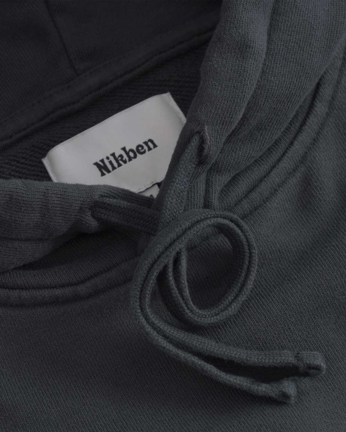 Close up of drawstrings on black cropped hoodie