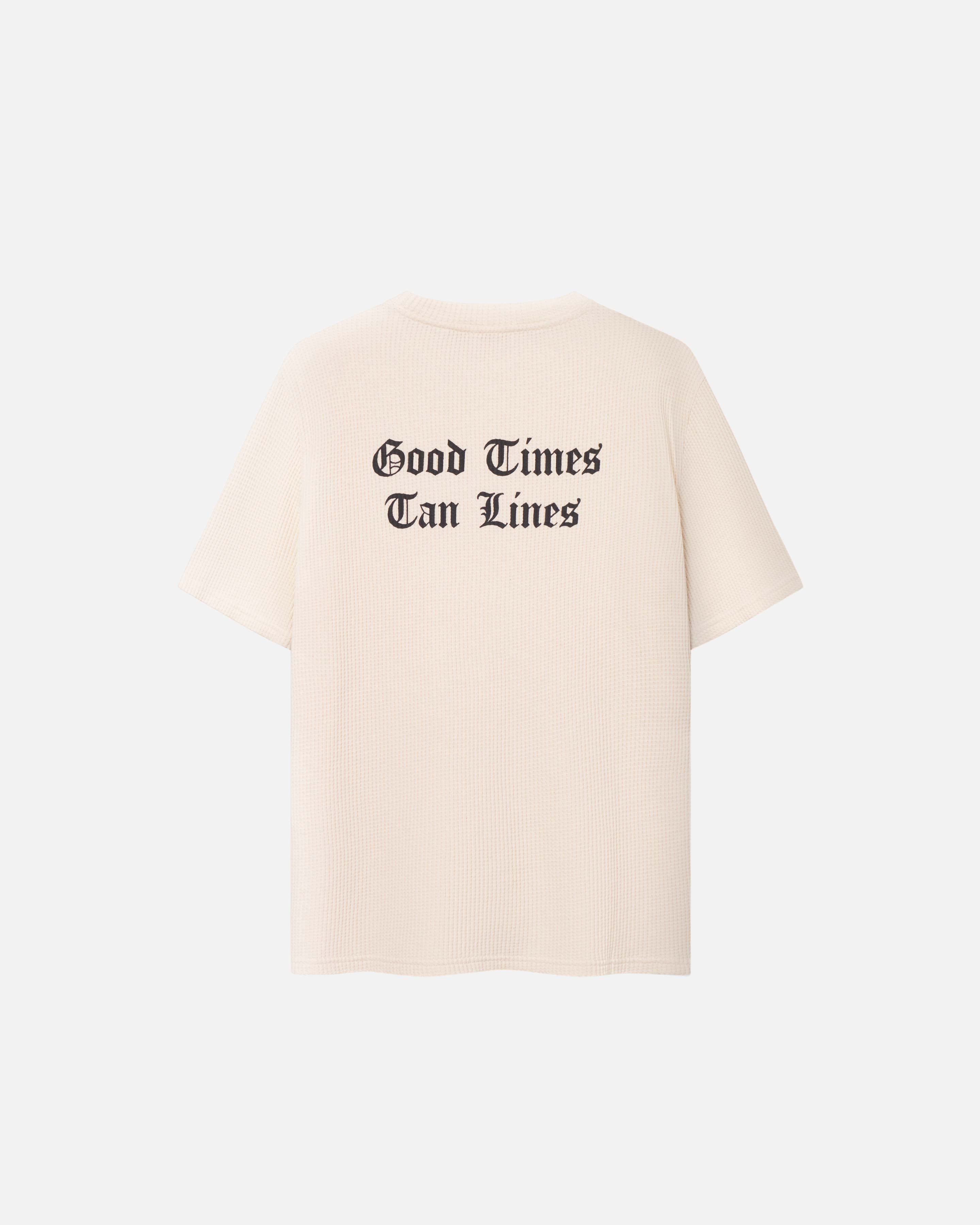 Cream Colored waffle patterned t-shirt with black text print