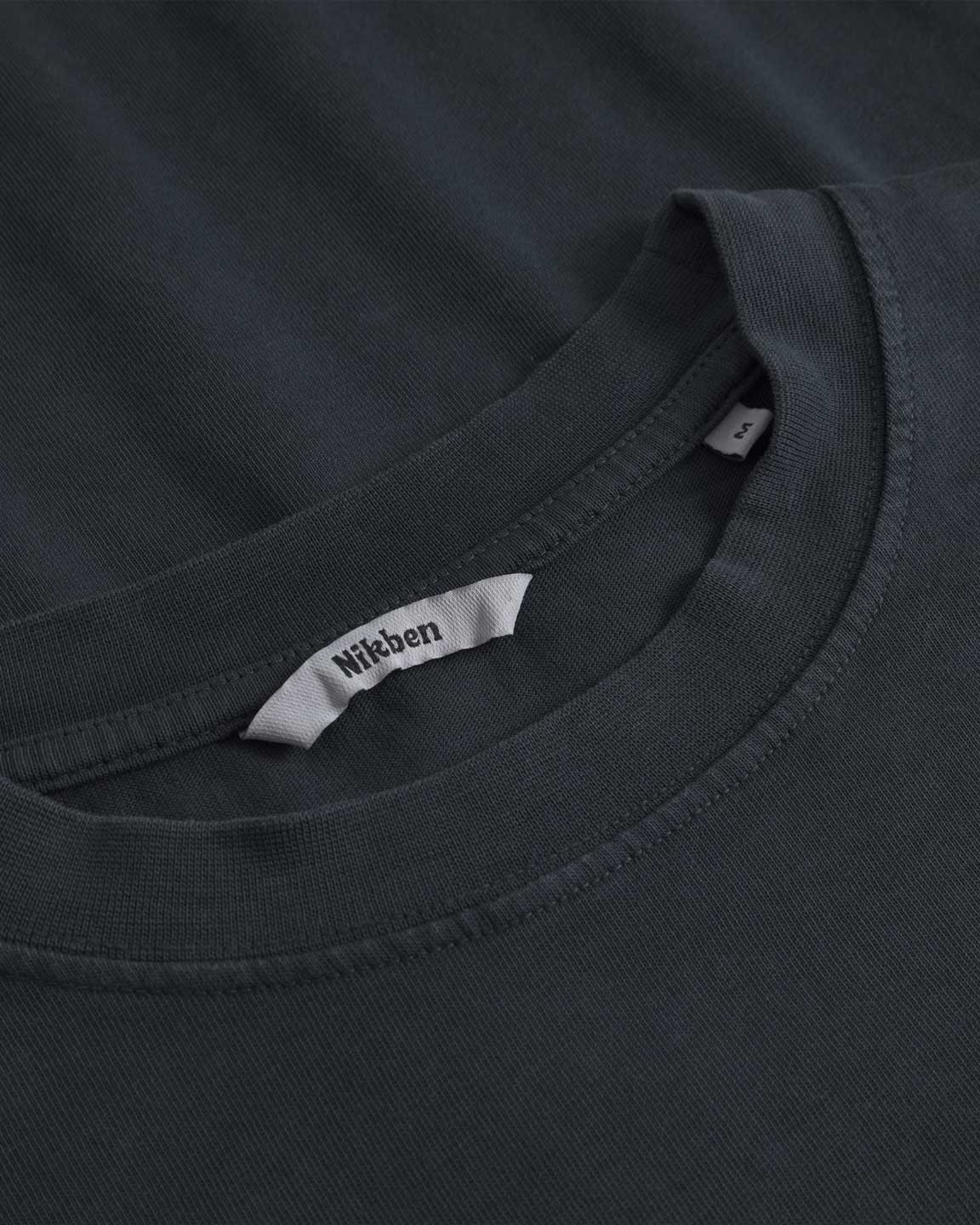 Close up of collar on a black t-shirt with 