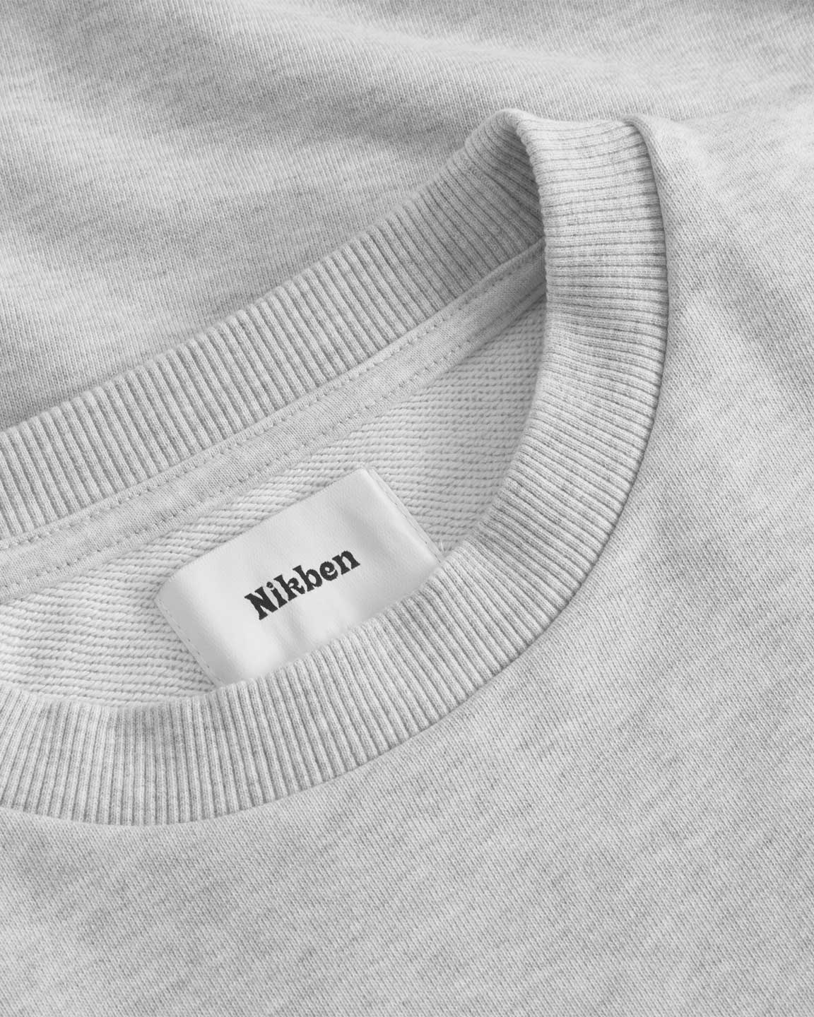 Close up of ribbed collar on a grey sweatshirt