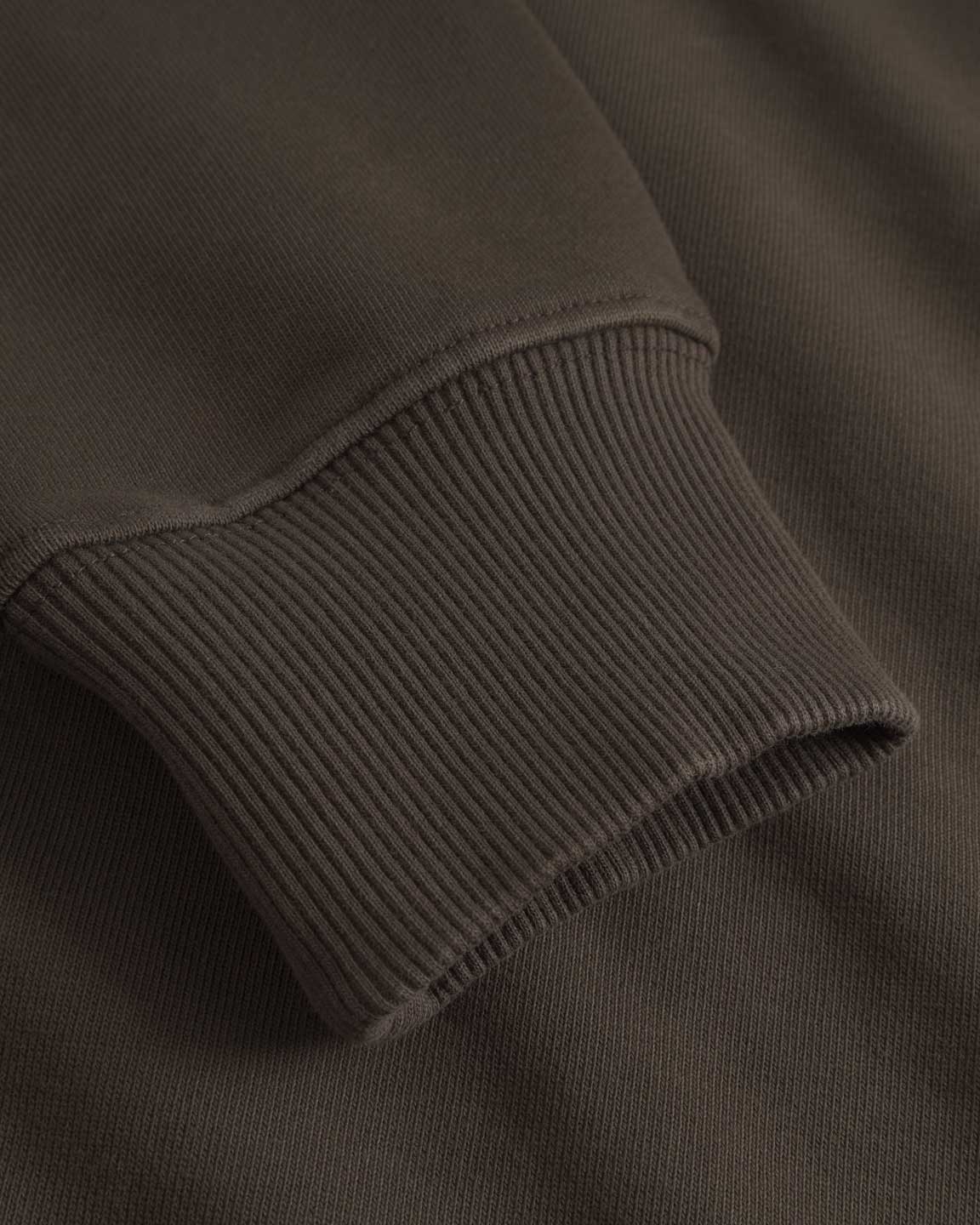 Close up of ribbed cuffs on a Tarmac colored sweatshirt