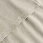 Close-up of beige fabric with a folded edge