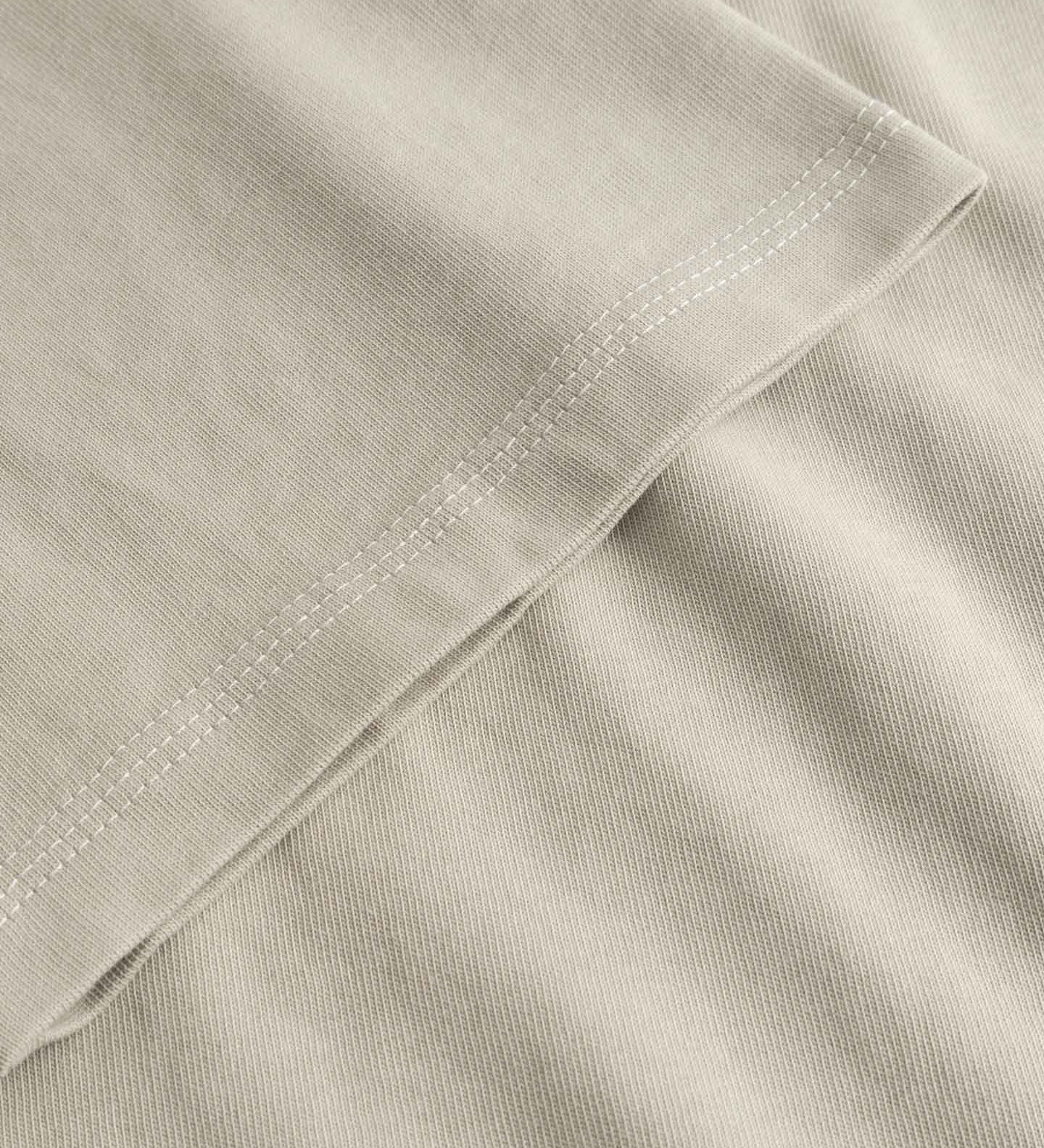 Close-up of beige fabric with a folded edge