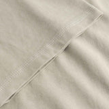 Close-up of beige fabric with a folded edge