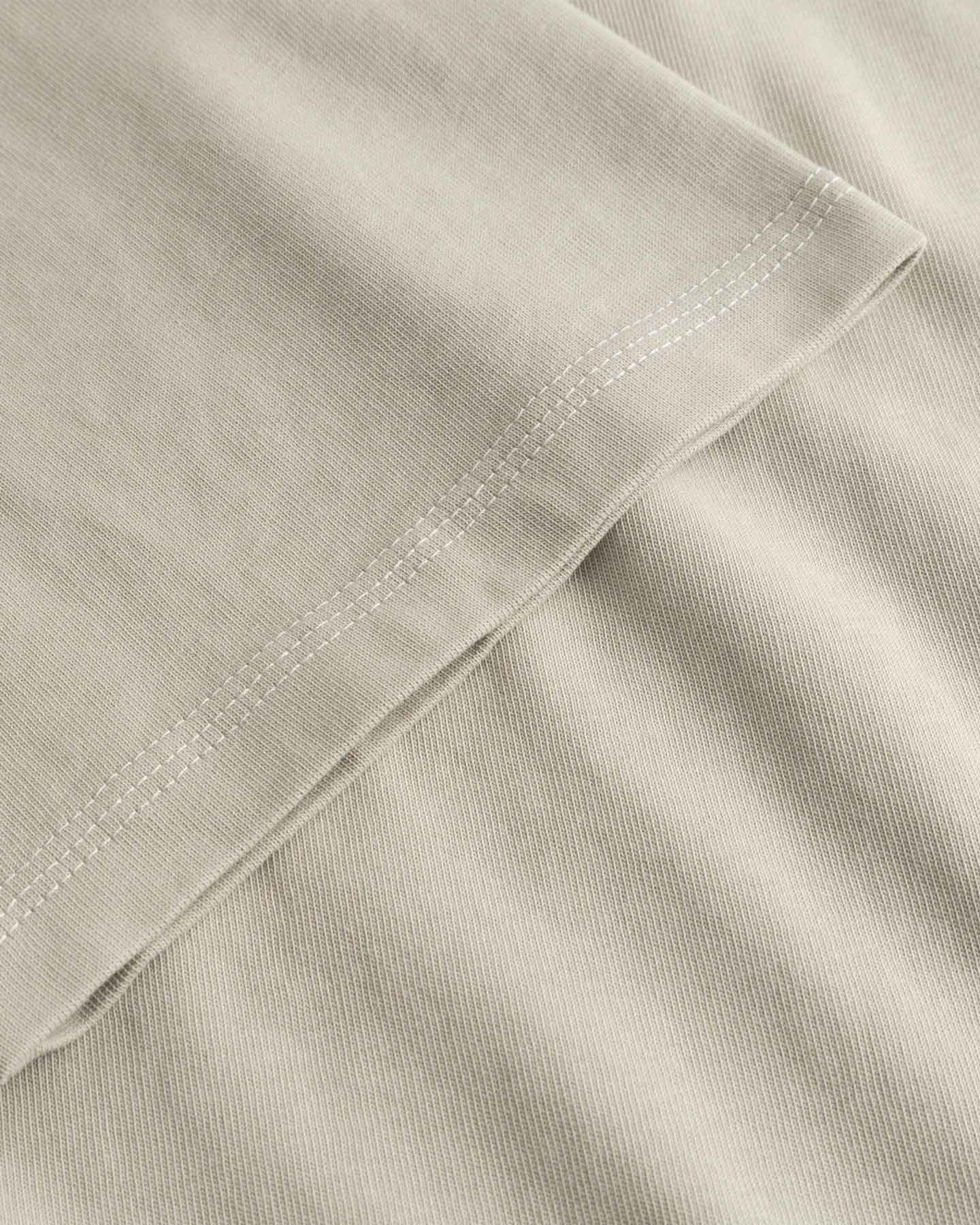 Close-up of beige fabric with a folded edge