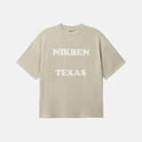 Beige t-shirt with 'NIKBEN TEXAS' text on the front
