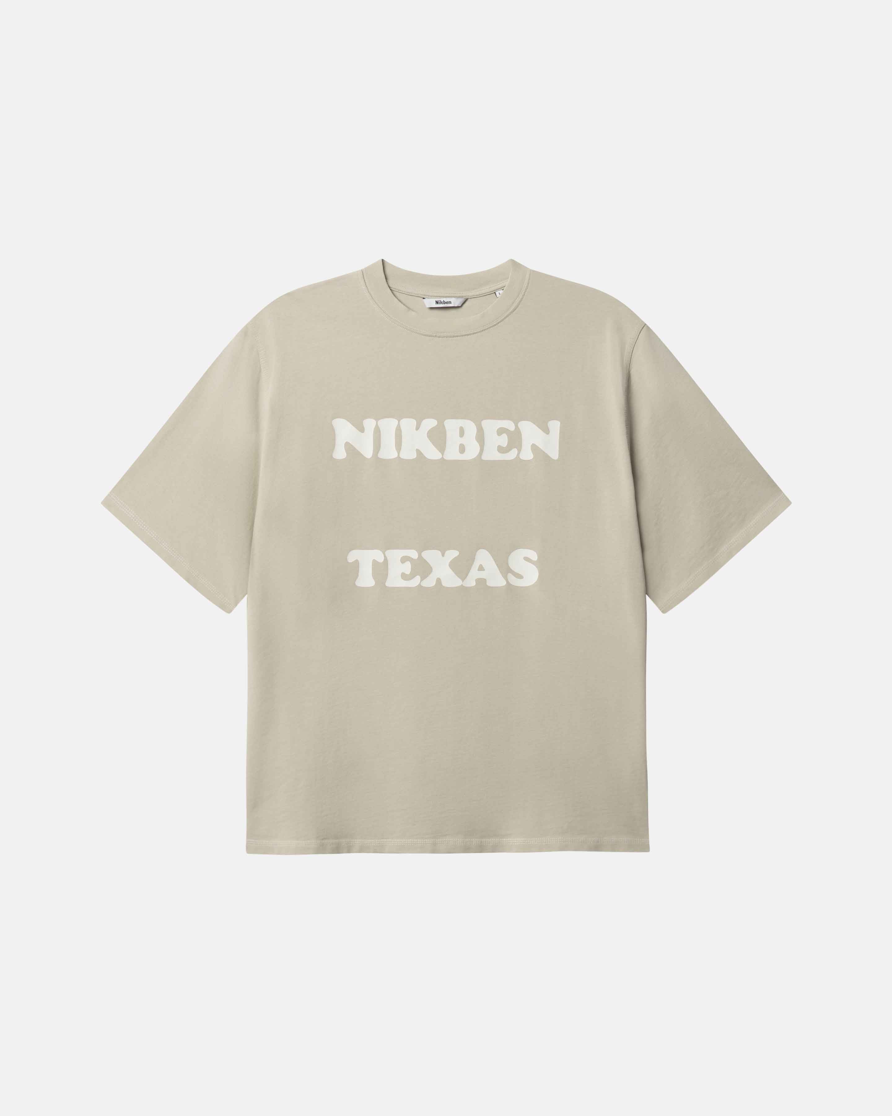 Beige t-shirt with 'NIKBEN TEXAS' text on the front