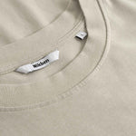 Close up of collar on beige t-shirt