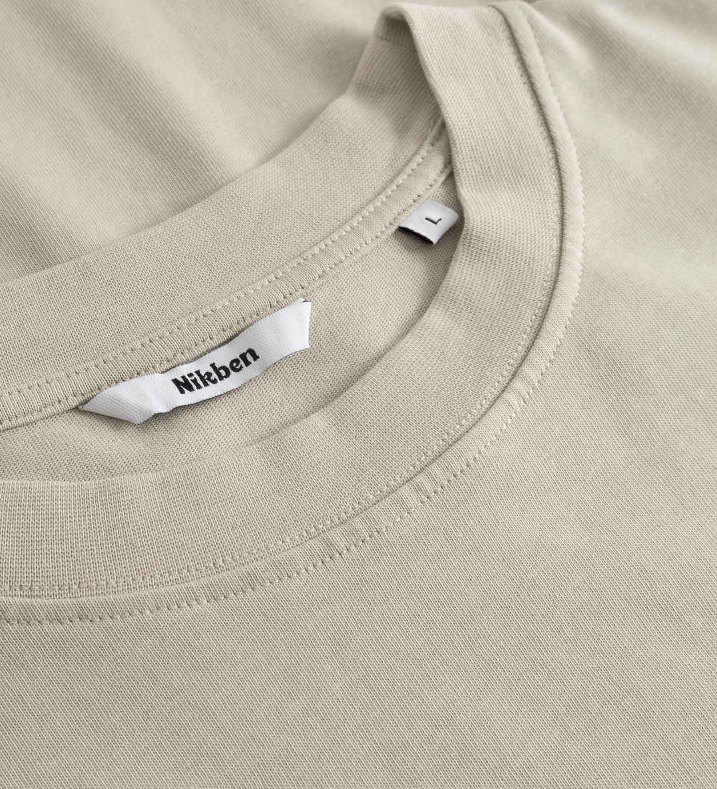 Close up of collar on beige t-shirt