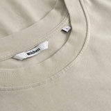 Close up of collar on beige t-shirt