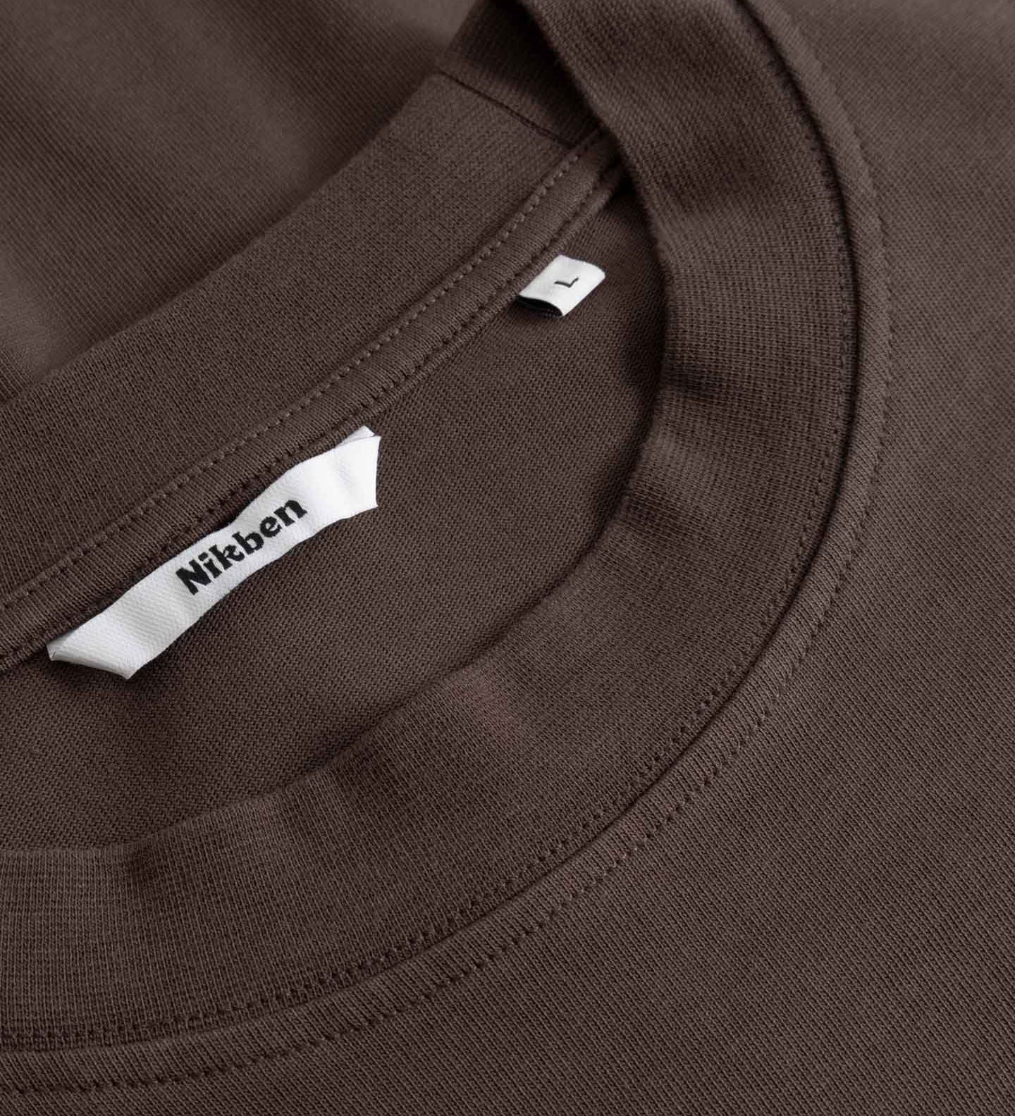 Close-up of a brown T- Shirt with a Nikben label