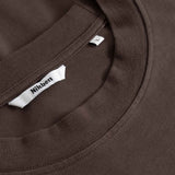 Close-up of a brown T- Shirt with a Nikben label