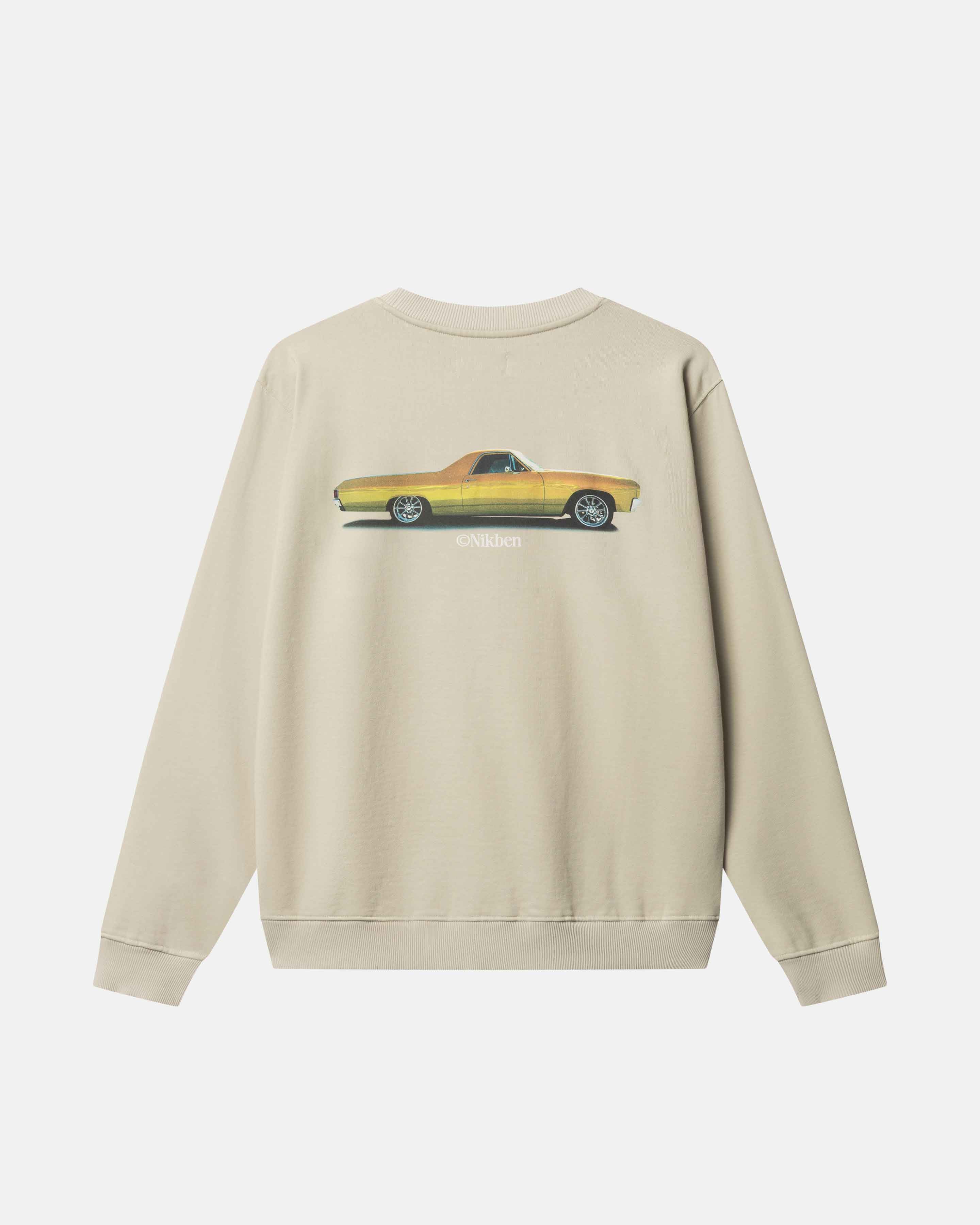 Beige sweatshirt with a yellow car graphic on the back 