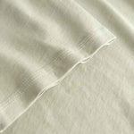 Close-up of beige fabric with a subtle texture