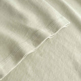 Close-up of beige fabric with a subtle texture
