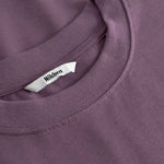 Close-up of a purple t-shirt with a brand label on the collar.