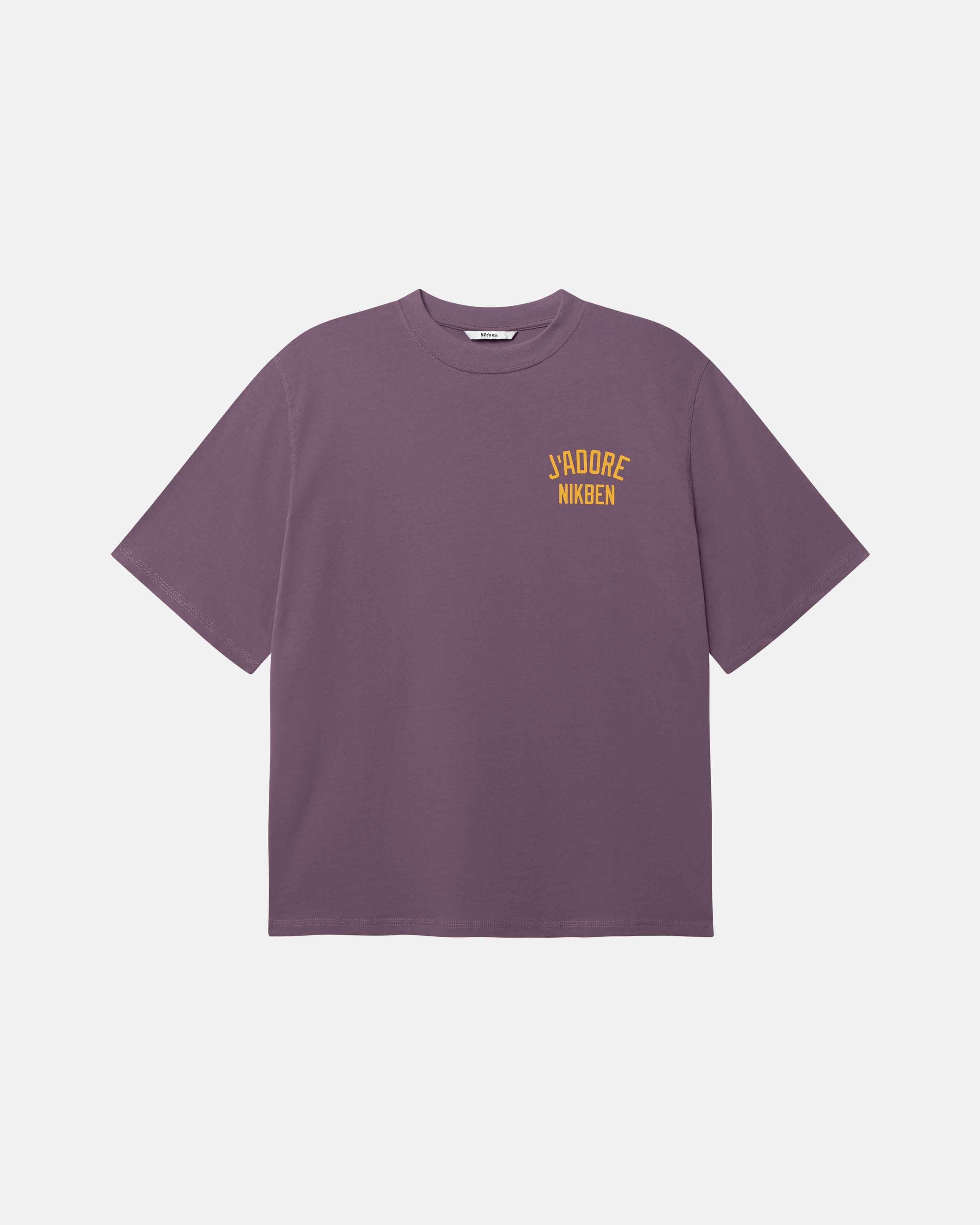 Purple t-shirt with yellow text on front breast pocket