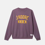 Purple sweatshirt with yellow text on Chest ´j'adore NIKBEN'