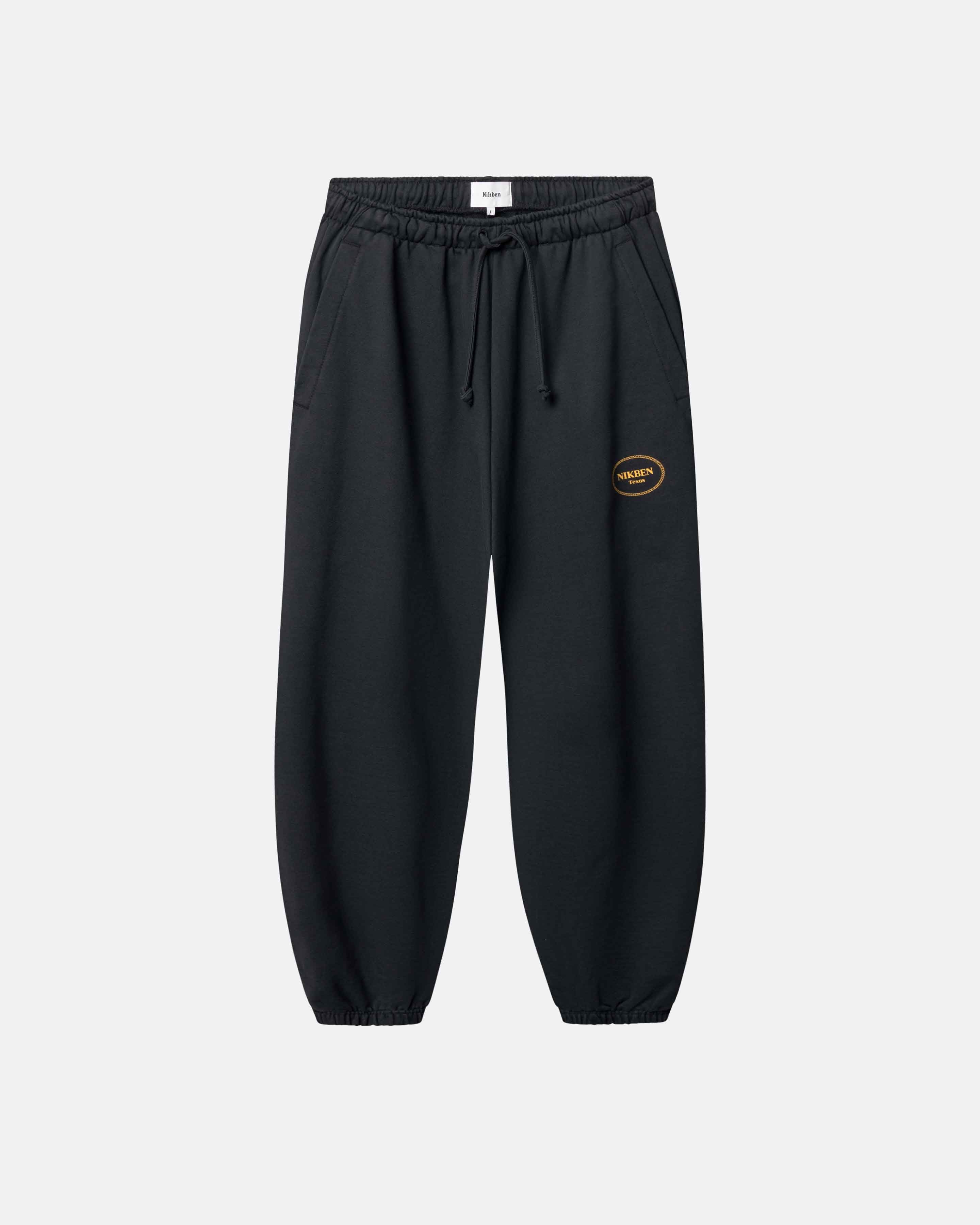 Black jogger pants with a small logo on leg