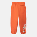 Orange pants with a brand logo on side 