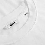 Close-up of a white t shirt with a brand label on a white tshirt