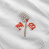 Close up of embroidered logo on front breast pocket