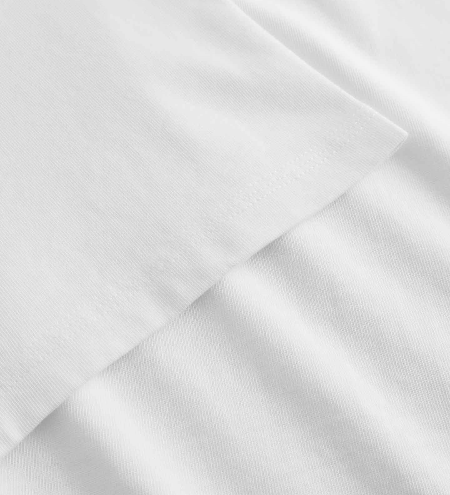 Close-up of white fabric with hem