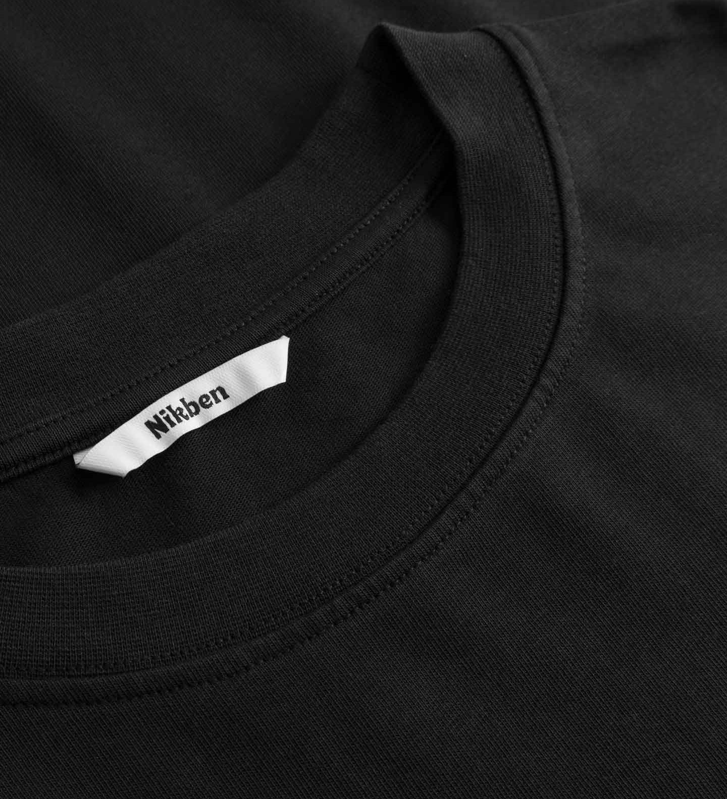 Black t-shirt with a Nikken label on the collar
