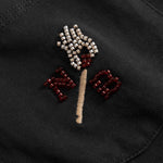 Close up of Embroidered design on a black fabric 