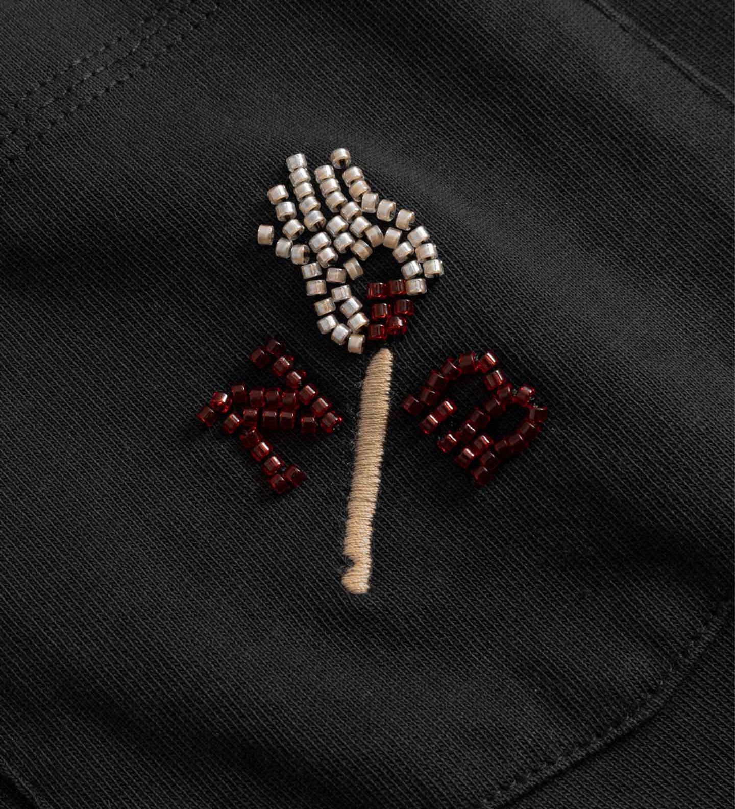 Close up of Embroidered design on a black fabric 