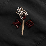 Close up of Embroidered design on a black fabric 