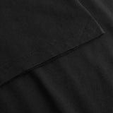 Close-up of a black t-shirt with folded hem