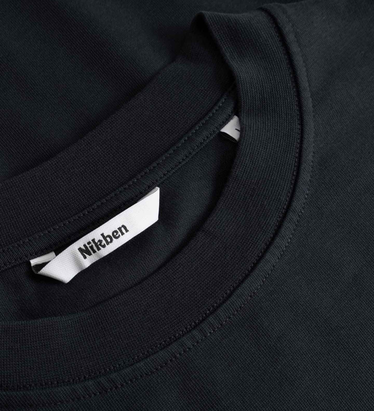 Black t-shirt with a brand label on the collar