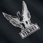 Nikben logo with an eagle design on black fabric