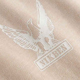 Close-up of a logo on a beige fabric 