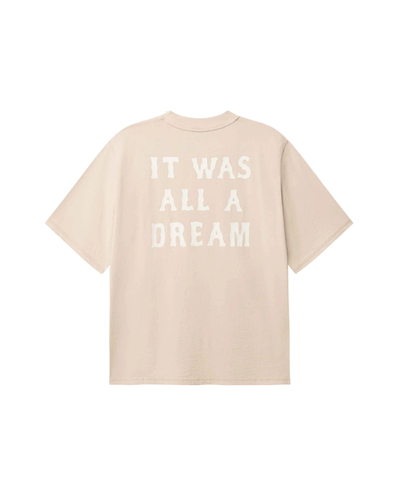 Beige t-shirt with 'IT WAS ALL A DREAM' text in white on back