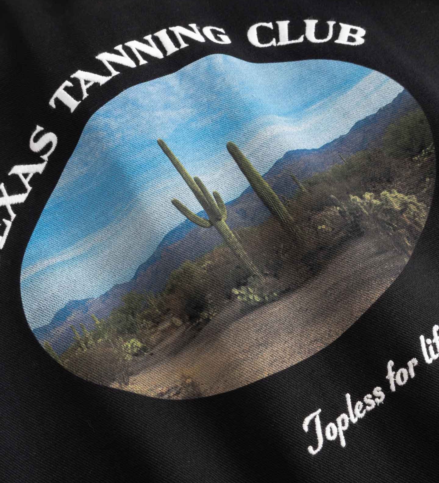 Close up of logo on  back of longsleeve shirt