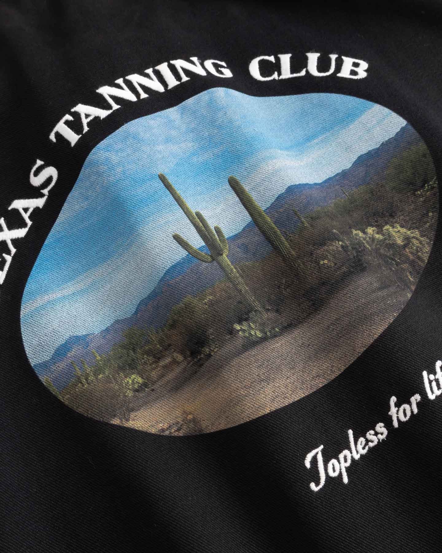 Close up of logo on  back of longsleeve shirt