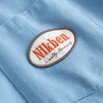Close up of Nikben brand logo on breast pocket