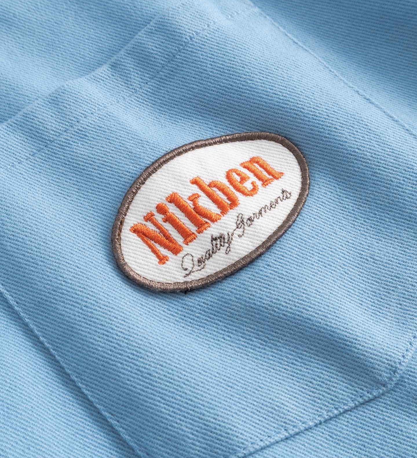 Close up of Nikben brand logo on breast pocket
