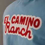 Blue overshirt with 'El Camino Ranch' text in red and white on the back 