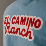 Blue overshirt with 'El Camino Ranch' text in red and white on the back 