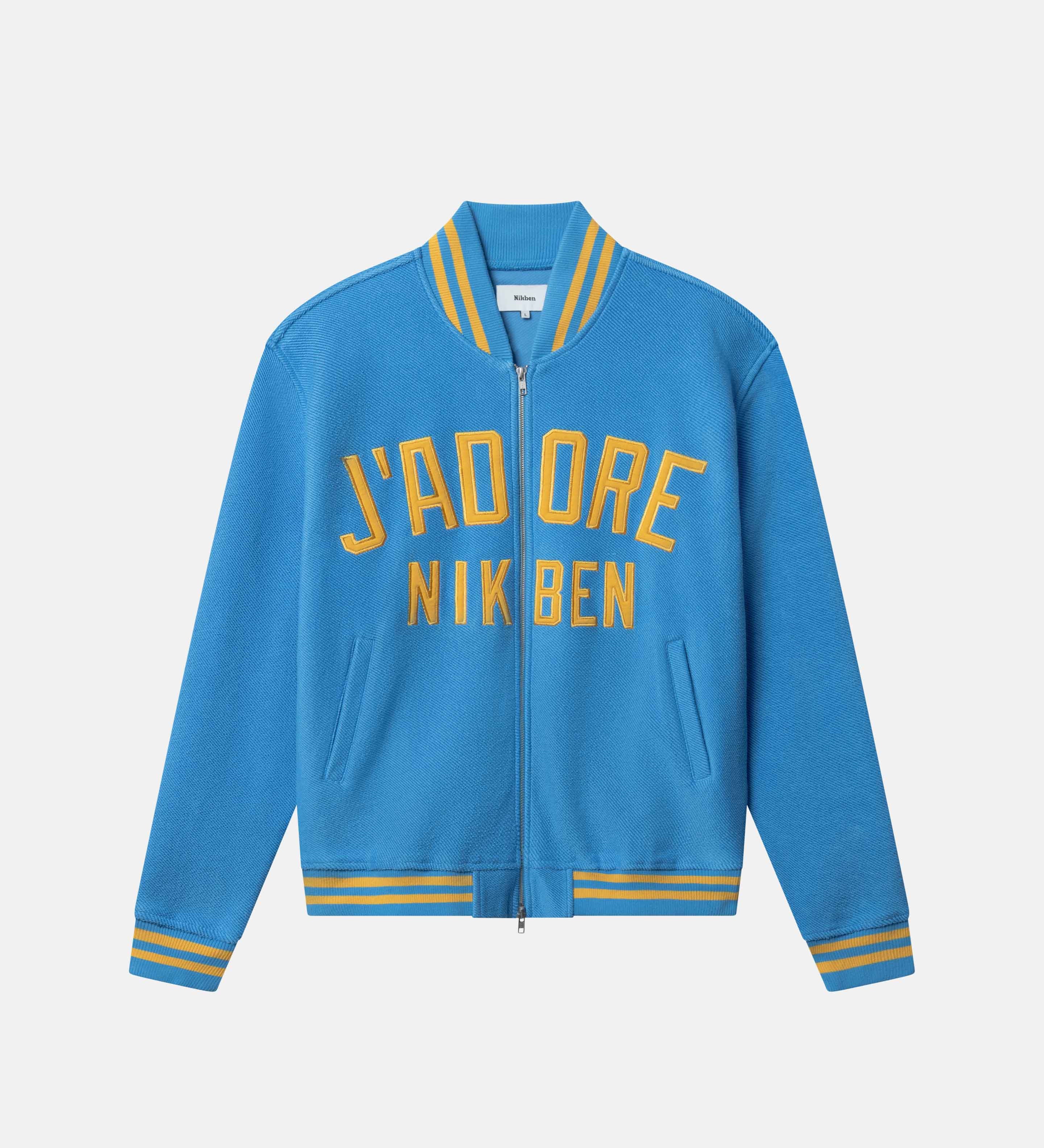 Blue bomber jacket with yellow text on the front