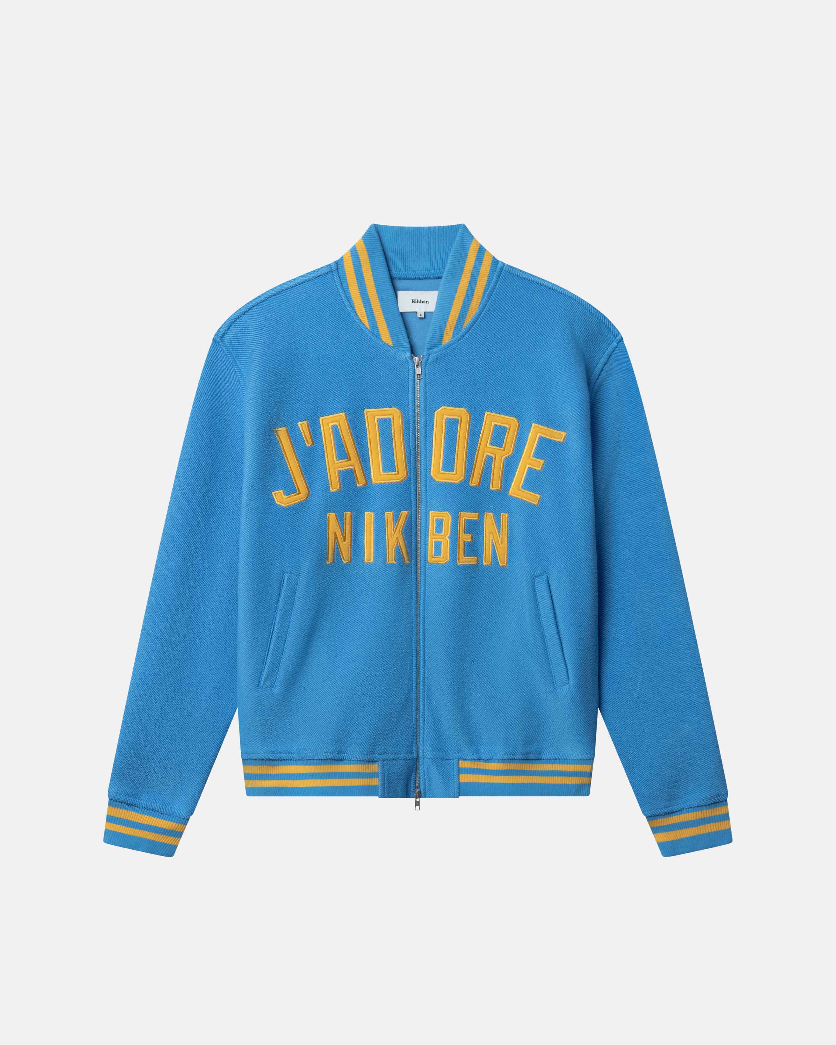 Blue bomber jacket with yellow text on the front