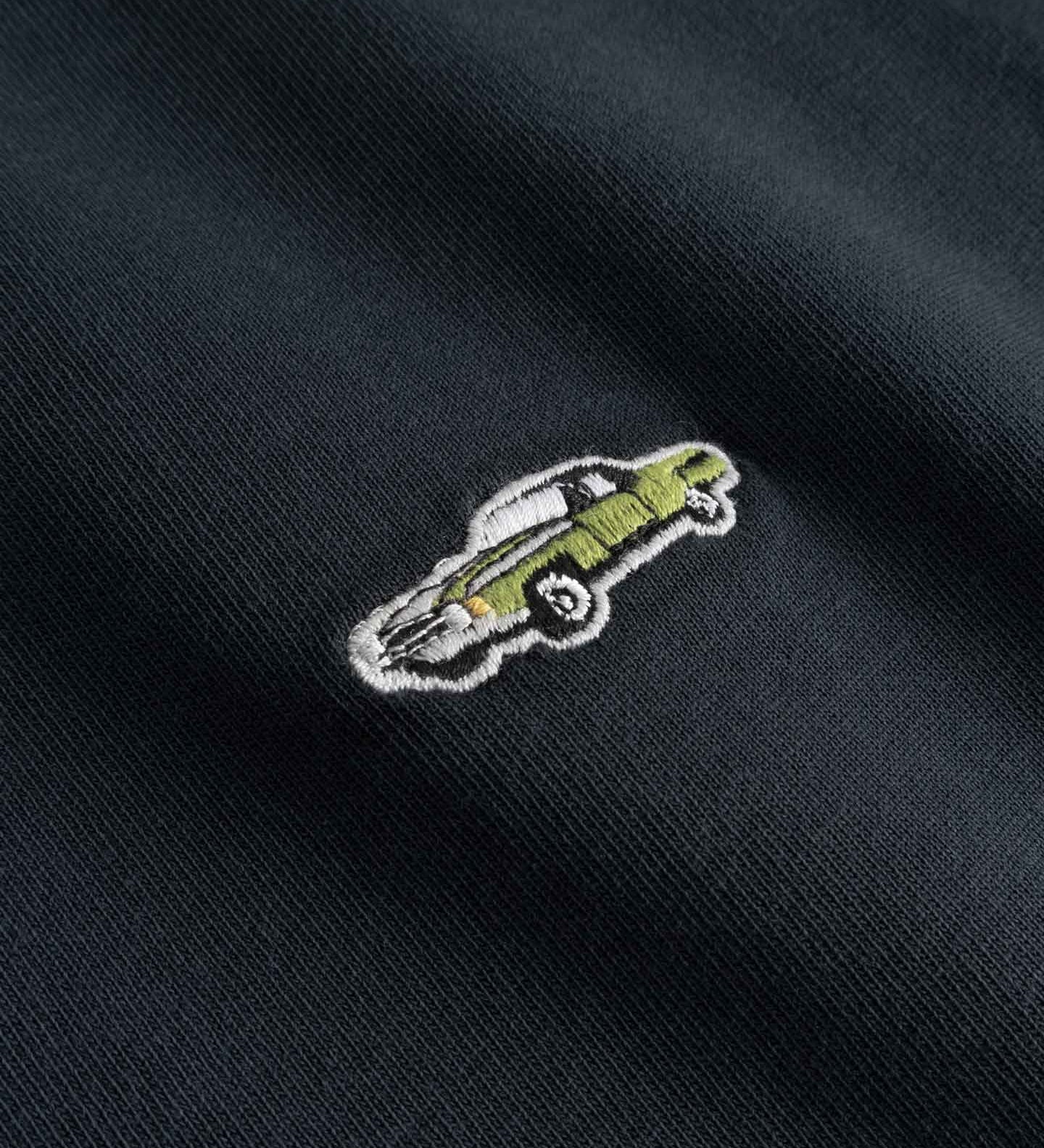 Close up of Embroidered car design on a black fabric 
