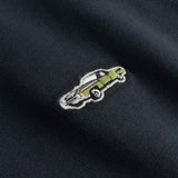 Close up of Embroidered car design on a black fabric 